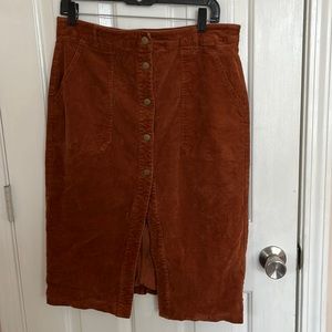 Corduroy button up midi length skirt, working buttons and pockets, no stains